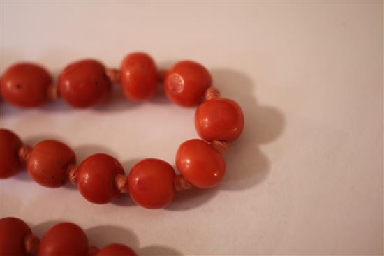 A single strand coral bead necklace, 20 in.